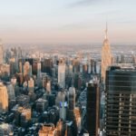 High towers and and multistage buildings located in central district of New York city on bay coast